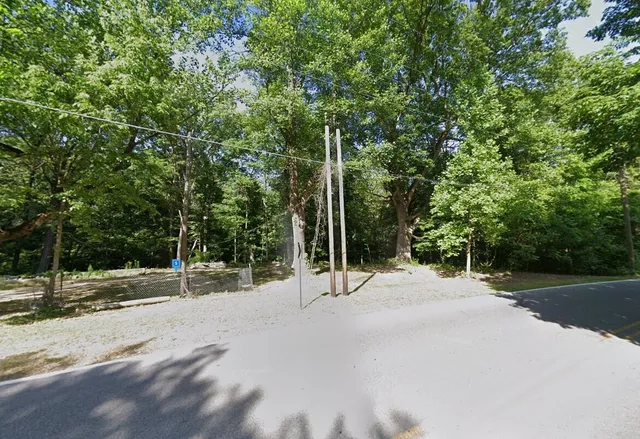 a view of a road with a trees