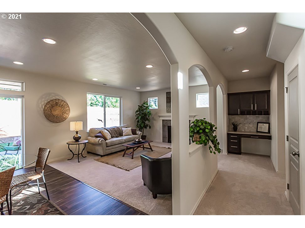 1375 Lorien Lane Eugene, OR 97404 - Photo 5 of 7 a living room with furniture a chandelier and a large window