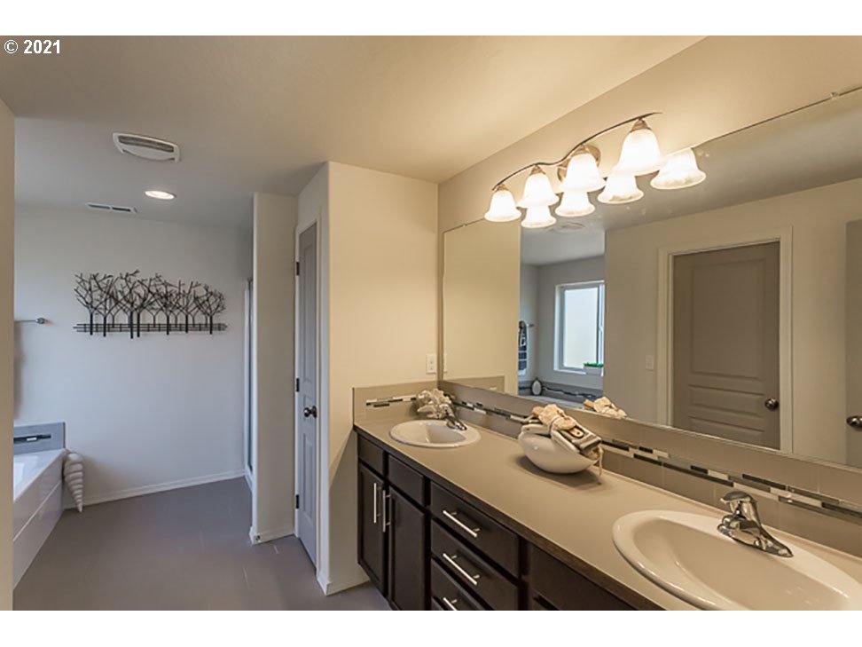 1375 Lorien Lane Eugene, OR 97404 - Photo 7 of 7 a bathroom with a sink and a mirror
