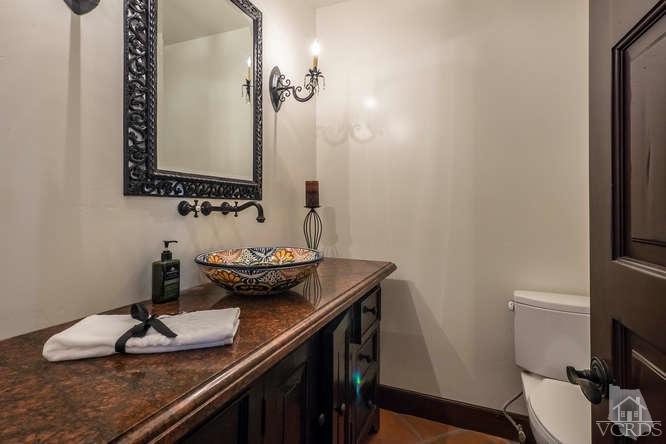 2016 Rayshire Street Thousand Oaks, CA 91362 - Photo 24 of 66 a bathroom with a granite countertop sink and a mirror