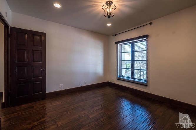 2016 Rayshire Street Thousand Oaks, CA 91362 - Photo 40 of 66 a view of an empty room with wooden floor and a window