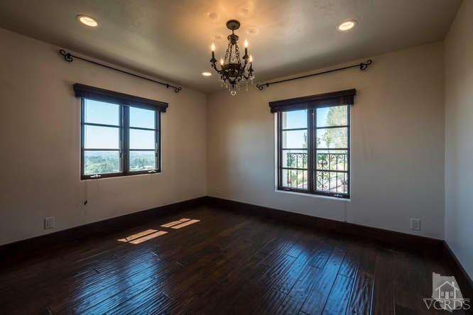 2016 Rayshire Street Thousand Oaks, CA 91362 - Photo 43 of 66 a view of an empty room with wooden floor and a window