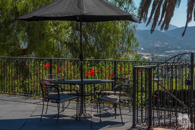 2016 Rayshire Street Thousand Oaks, CA 91362 - Photo 54 of 66 a balcony with wooden floor table and chairs