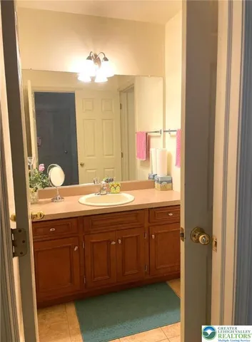 a bed sitting in a room next to a window