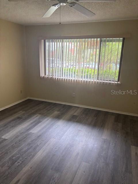 149 Club House Boulevard, Unit 149 New Smyrna Beach, FL 32168 - Photo 22 of 32 wooden floor in an empty room with a window