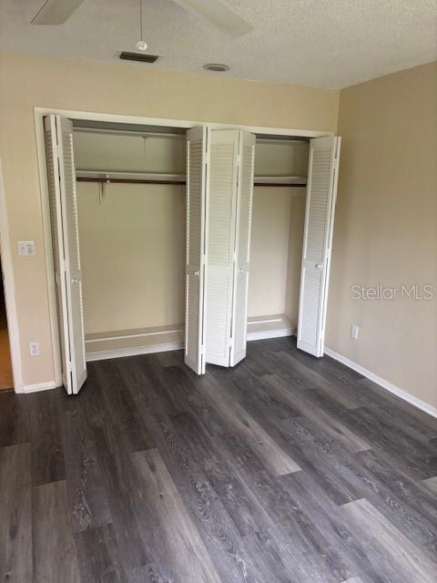 149 Club House Boulevard, Unit 149 New Smyrna Beach, FL 32168 - Photo 23 of 32 an empty room with wooden floor and closet