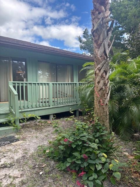 149 Club House Boulevard, Unit 149 New Smyrna Beach, FL 32168 - Photo 27 of 32 a view of a chair with a bench in backyard