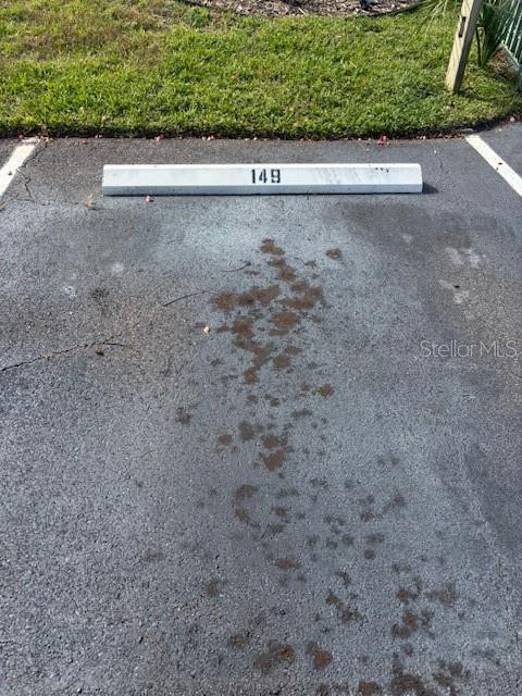 149 Club House Boulevard, Unit 149 New Smyrna Beach, FL 32168 - Photo 28 of 32 a view of a back yard with a wooden fence