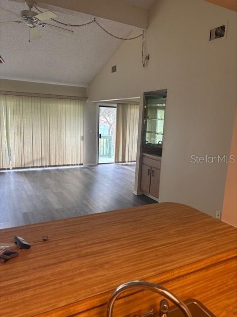 149 Club House Boulevard, Unit 149 New Smyrna Beach, FL 32168 - Photo 8 of 32 wooden floor in an empty room with a window