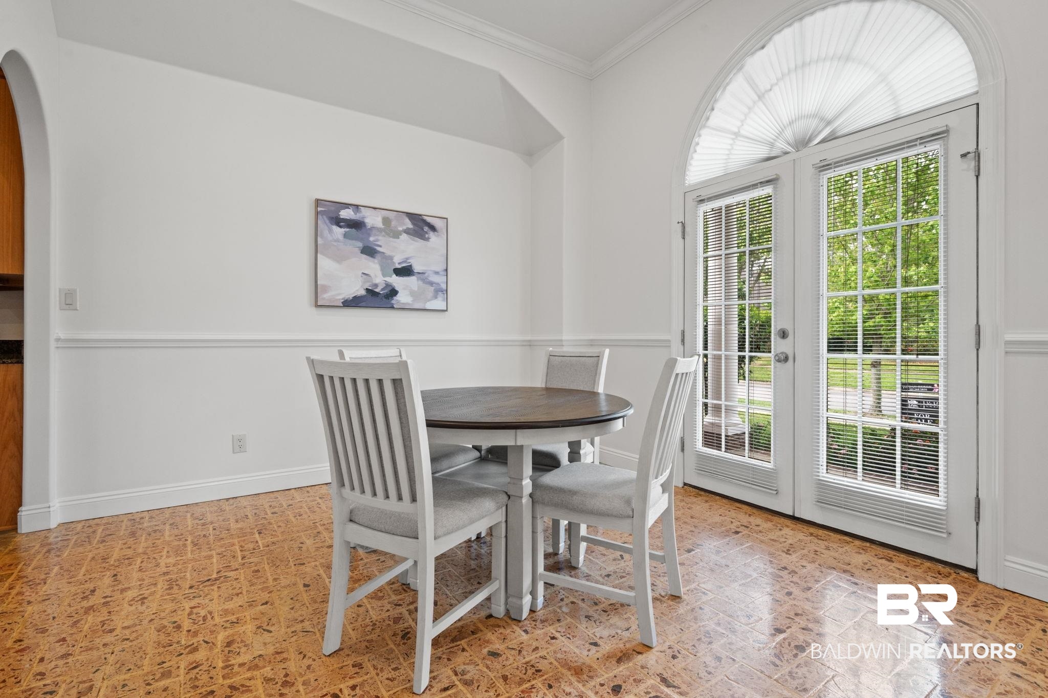 29634 St George Street Daphne, AL 36526 - Photo 11 of 47 Dining space with french doors, ornamental molding, and arched walkways