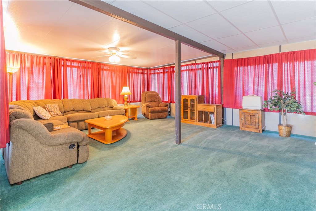 17516 Olive Street Hesperia, CA 92345 - Photo 14 of 32 a living room with furniture and a chandelier