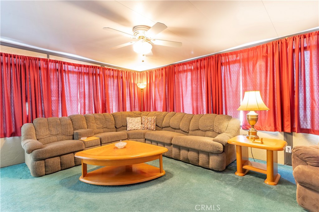 17516 Olive Street Hesperia, CA 92345 - Photo 15 of 32 a living room with furniture and a large window