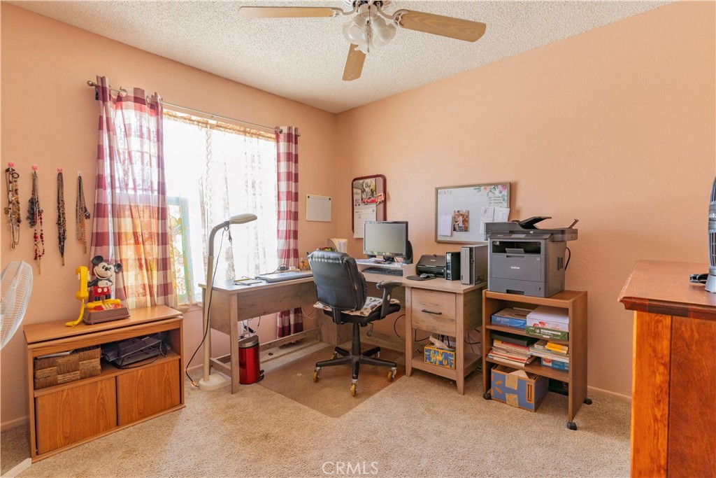 17516 Olive Street Hesperia, CA 92345 - Photo 18 of 32 a view of a workspace with furniture and a window