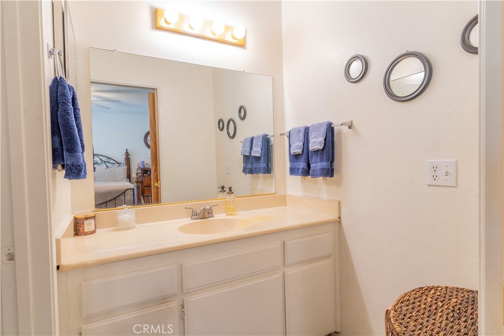 17516 Olive Street Hesperia, CA 92345 - Photo 21 of 32 a bathroom with a sink and a mirror