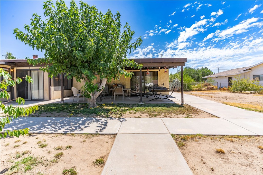 17516 Olive Street Hesperia, CA 92345 - Photo 25 of 32 a view of a backyard with a sitting area