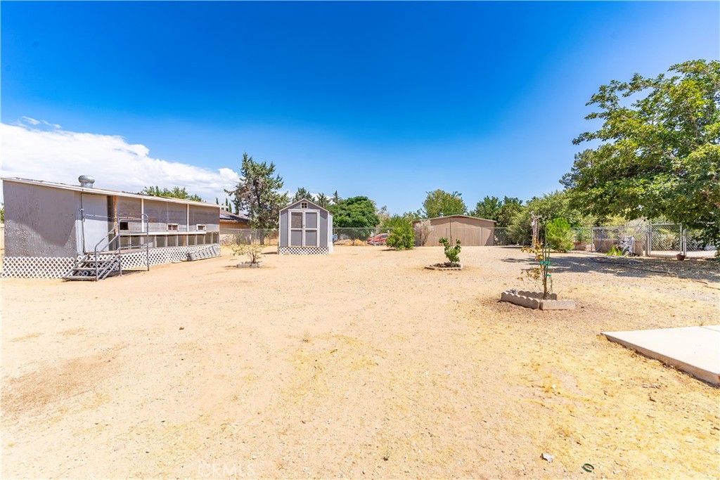 17516 Olive Street Hesperia, CA 92345 - Photo 27 of 32 a view of a swimming pool with a patio