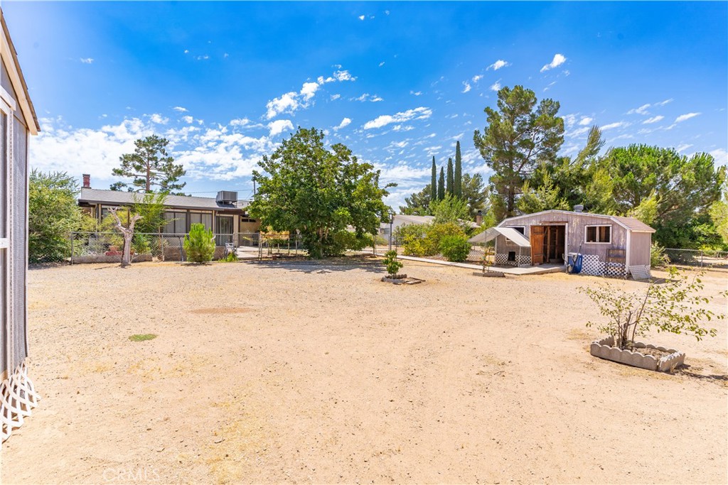 17516 Olive Street Hesperia, CA 92345 - Photo 28 of 32 a view of swimming pool with a yard