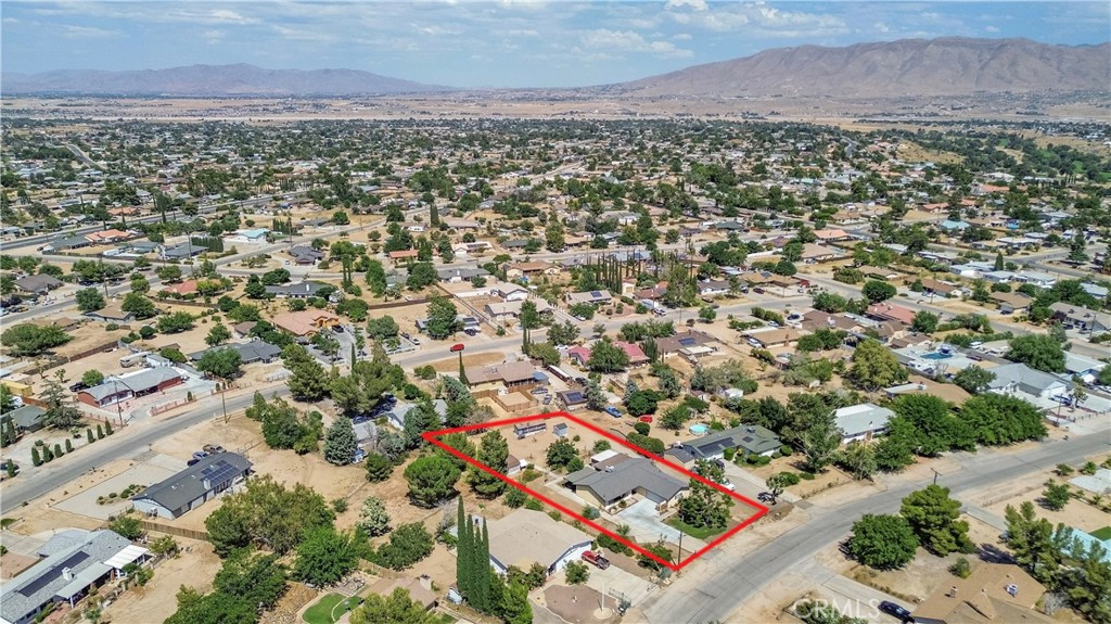 17516 Olive Street Hesperia, CA 92345 - Photo 30 of 32 an aerial view of residential houses with outdoor space