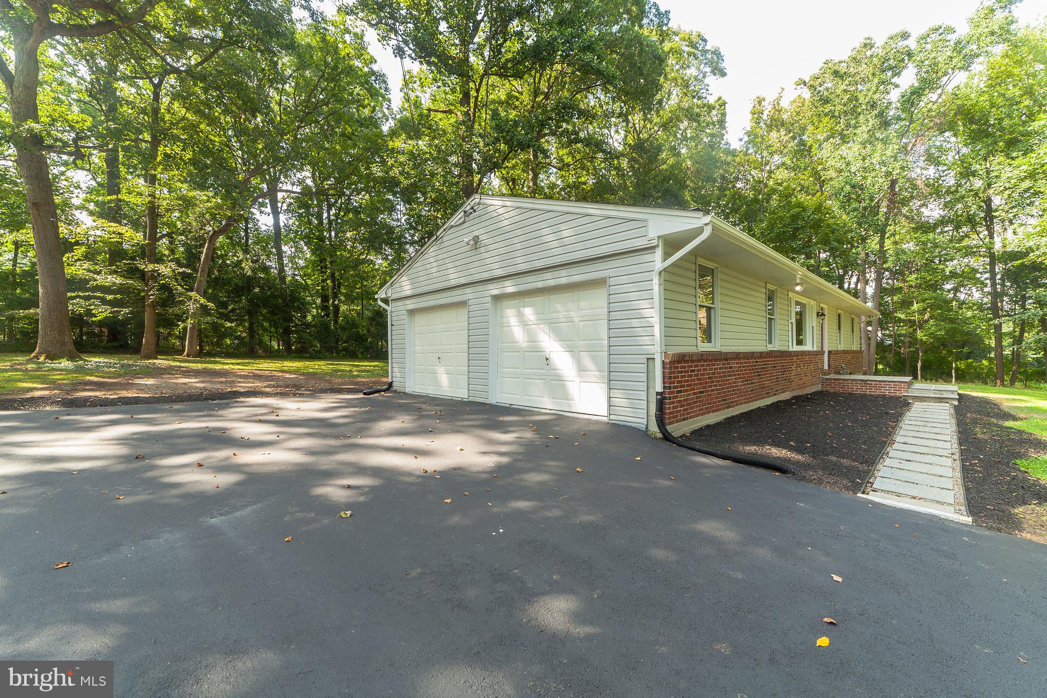 3804 Sweet Air Road Phoenix, MD 21131 - Photo 2 of 15 a view of a house with a yard and large trees