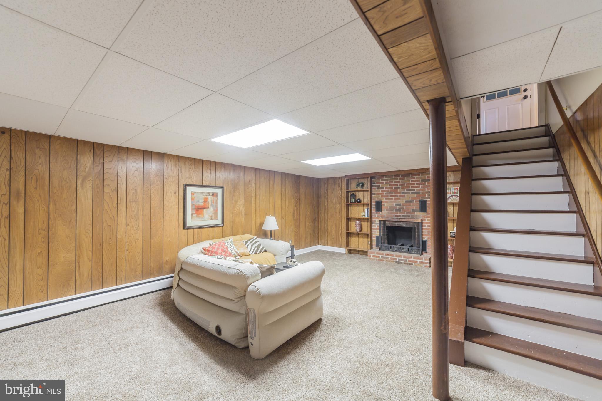 3804 Sweet Air Road Phoenix, MD 21131 - Photo 14 of 15 a living room with furniture and a fireplace