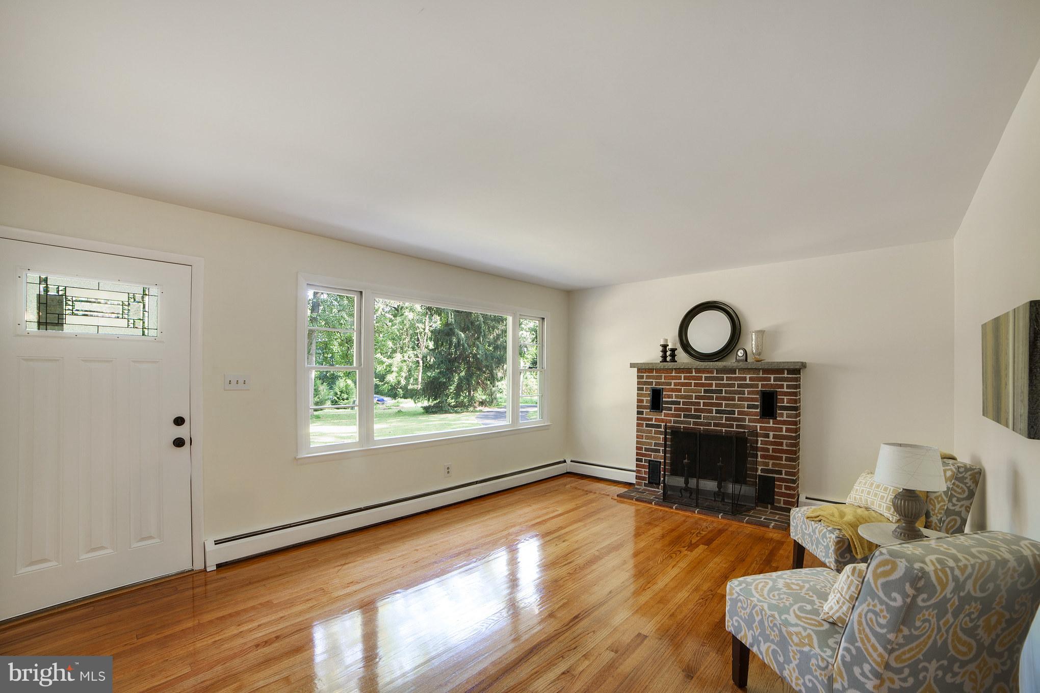 3804 Sweet Air Road Phoenix, MD 21131 - Photo 4 of 15 a living room with furniture and a fireplace