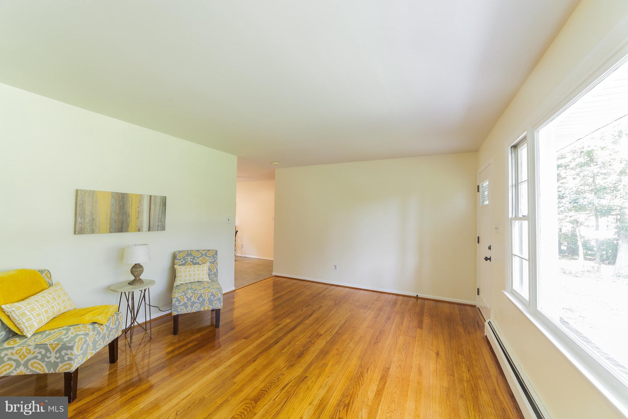 3804 Sweet Air Road Phoenix, MD 21131 - Photo 5 of 15 a view of a bedroom with wooden floor and furniture