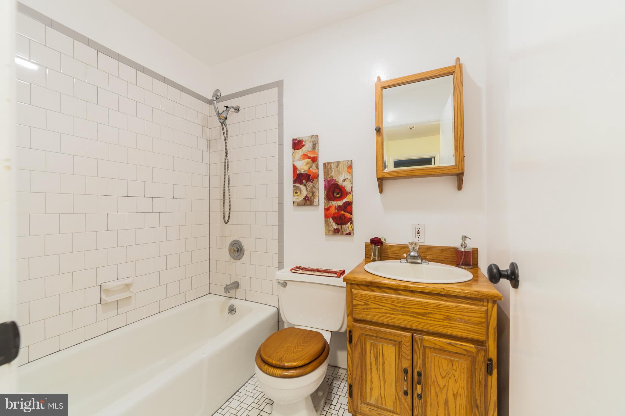 3804 Sweet Air Road Phoenix, MD 21131 - Photo 10 of 15 a bathroom with a sink a toilet and shower