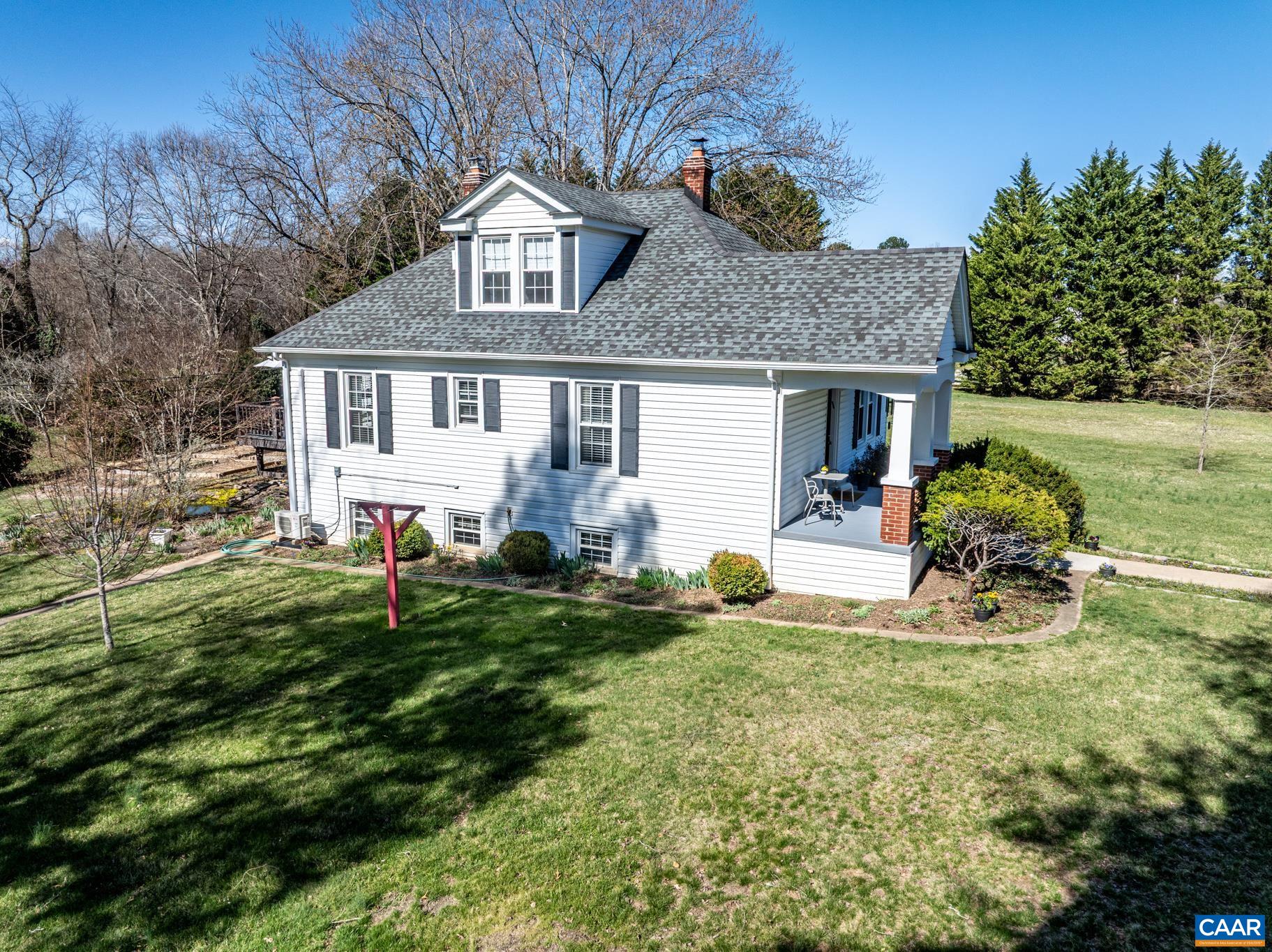 3188 Orange Road Aroda, VA 22709 - Photo 7 of 53 a front view of a house with a yard and trees