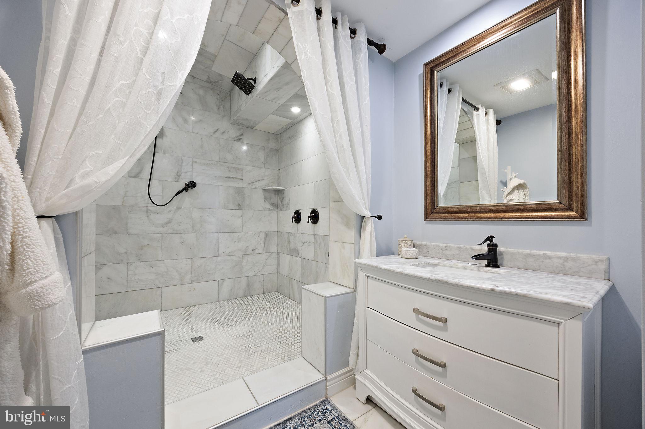 1400 Carson Road Wilmington, DE 19803 - Photo 17 of 44 a bathroom with a sink a toilet and shower