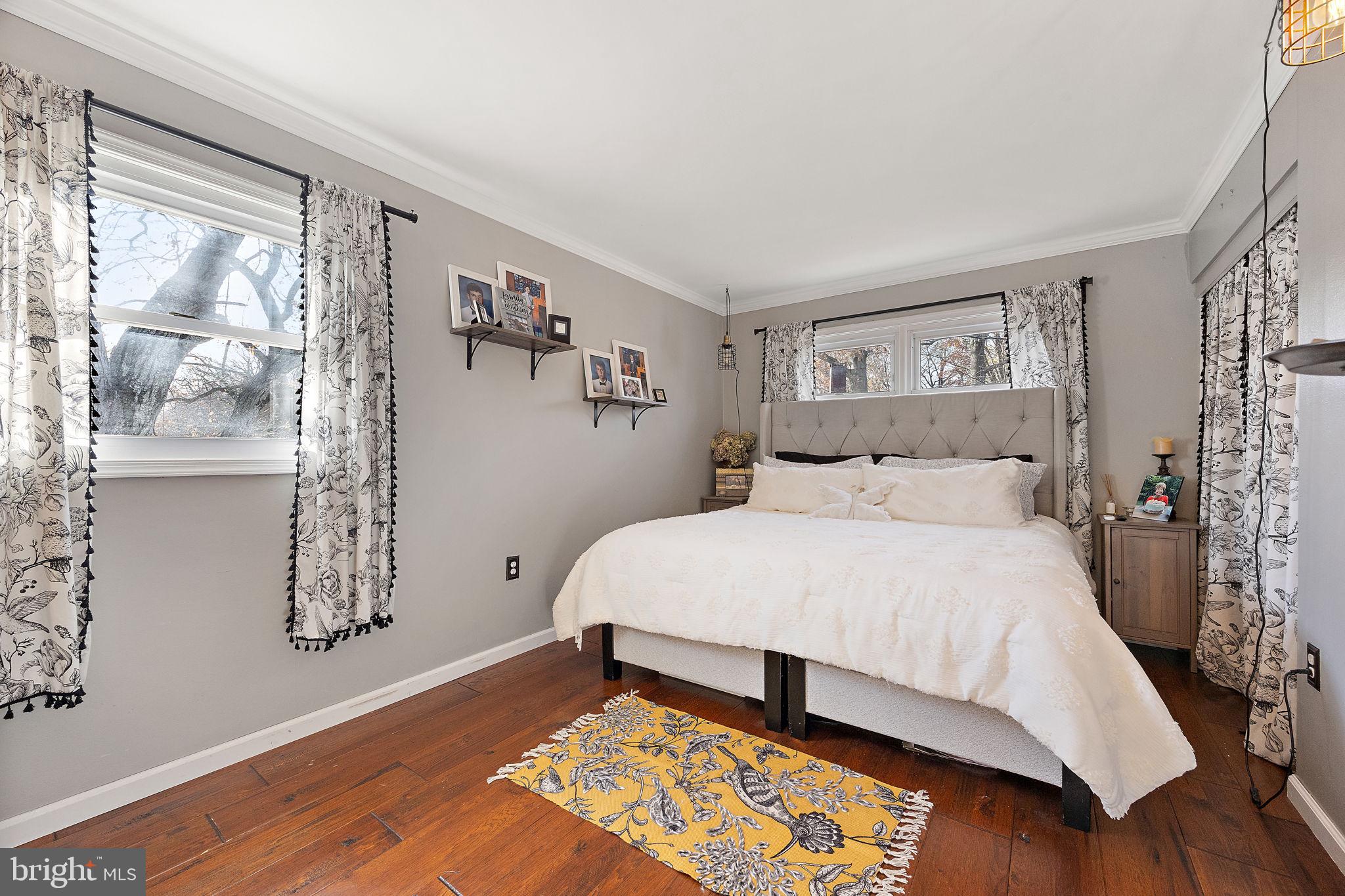 1400 Carson Road Wilmington, DE 19803 - Photo 24 of 44 a bedroom with a large bed and wooden floor