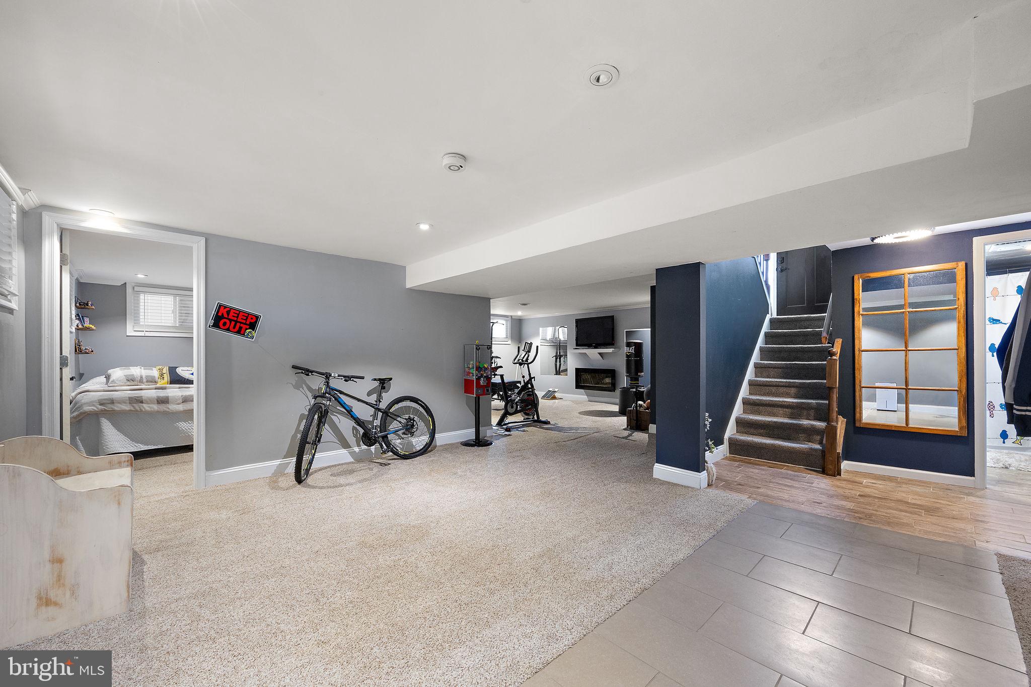 1400 Carson Road Wilmington, DE 19803 - Photo 28 of 44 a view of a livingroom with furniture and a gym cycle