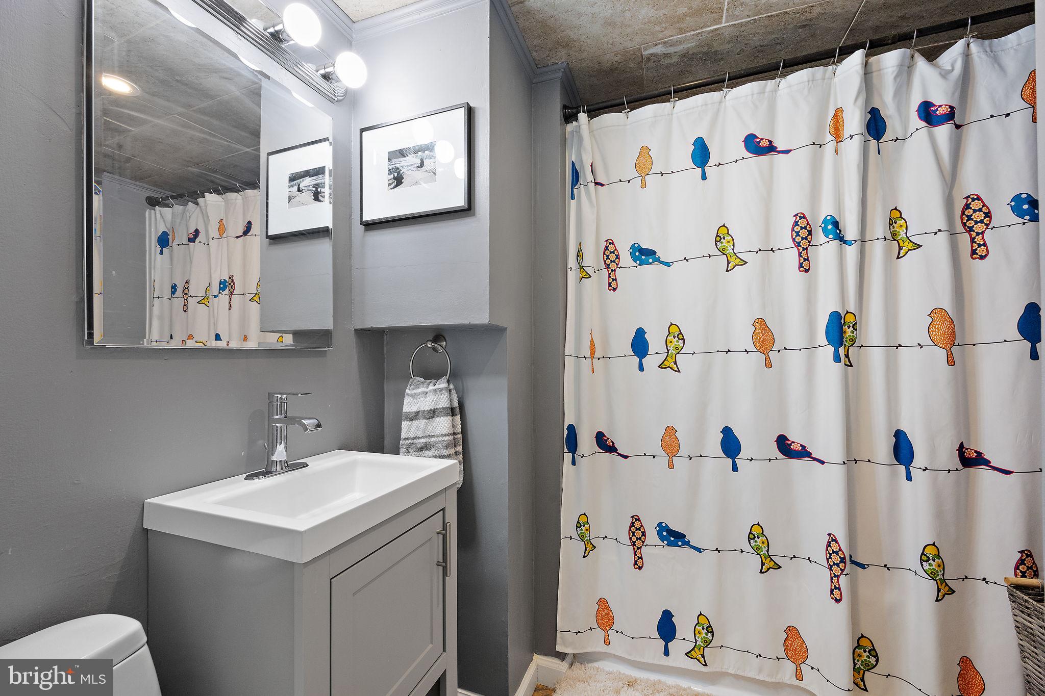 1400 Carson Road Wilmington, DE 19803 - Photo 30 of 44 a bathroom with a sink and a shower curtain