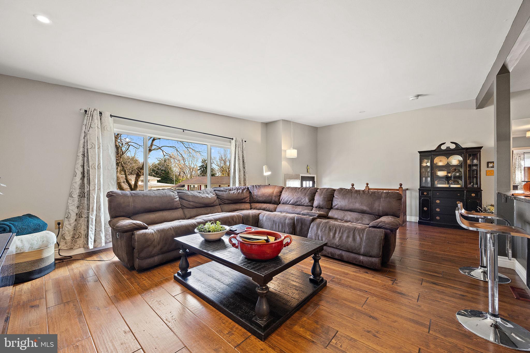 1400 Carson Road Wilmington, DE 19803 - Photo 7 of 44 a living room with furniture and a flat screen tv