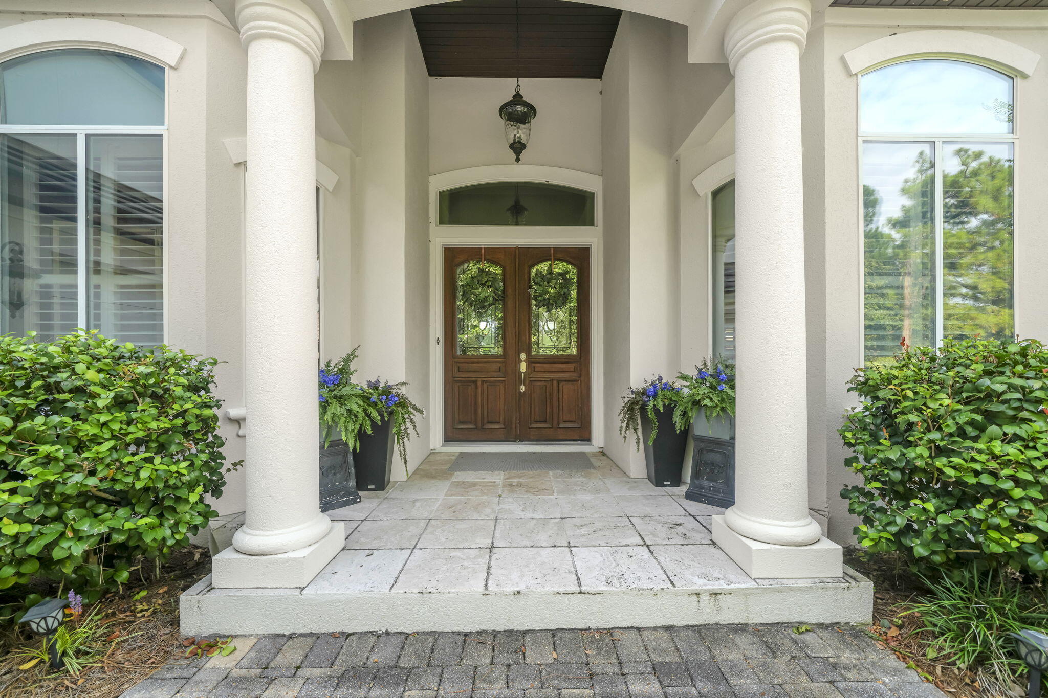 4470 Stonebridge Road Destin, FL 32541 - Photo 112 of 114 a front view of a house with potted plants