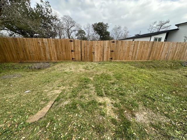 a view of outdoor space with wooden fence