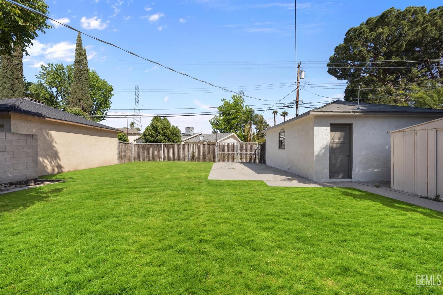 Undisclosed Address Bakersfield, CA 93301 - Photo 31 of 33 a view of a backyard with a garden and plants