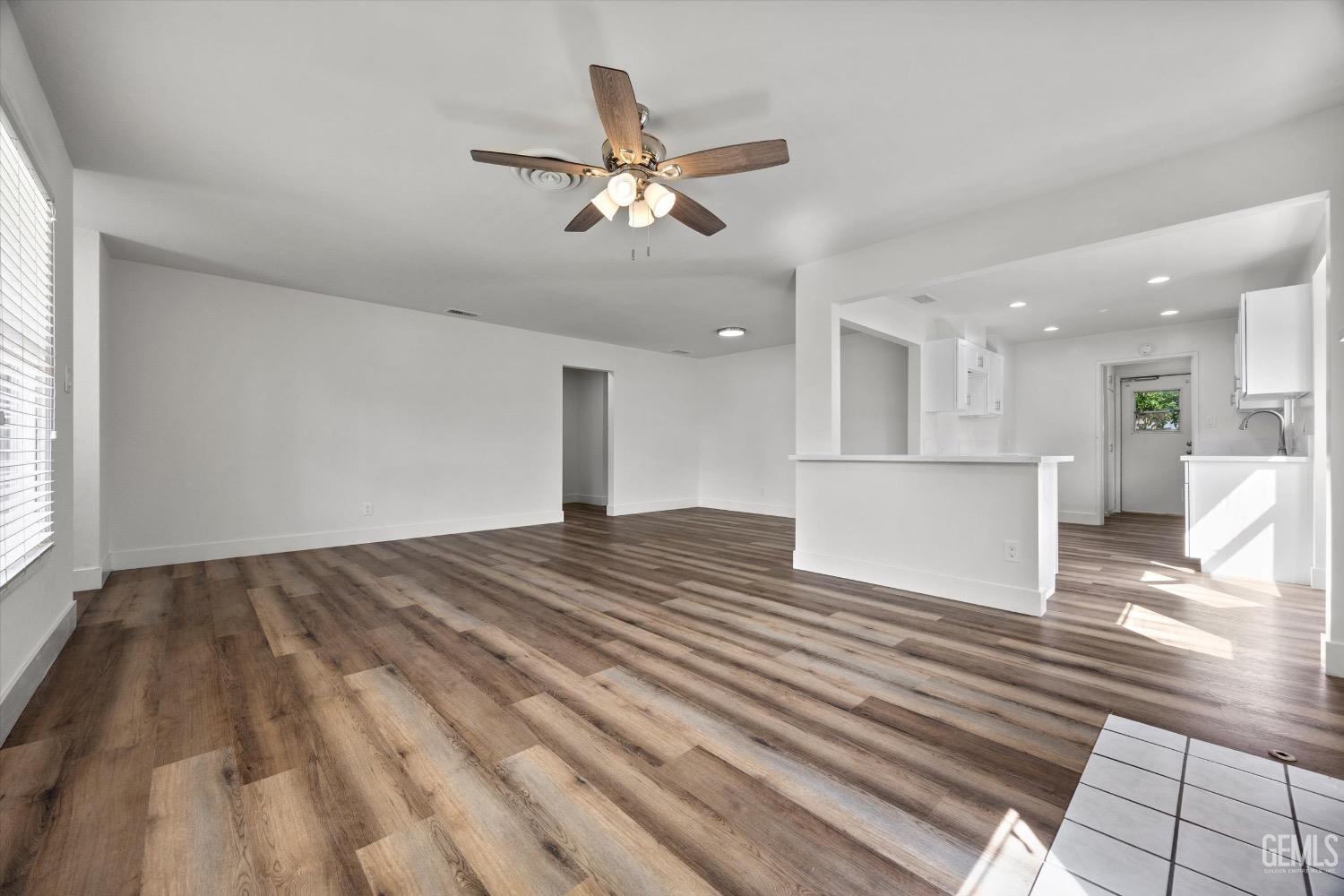 Undisclosed Address Bakersfield, CA 93301 - Photo 10 of 33 a view of an empty room and kitchen view