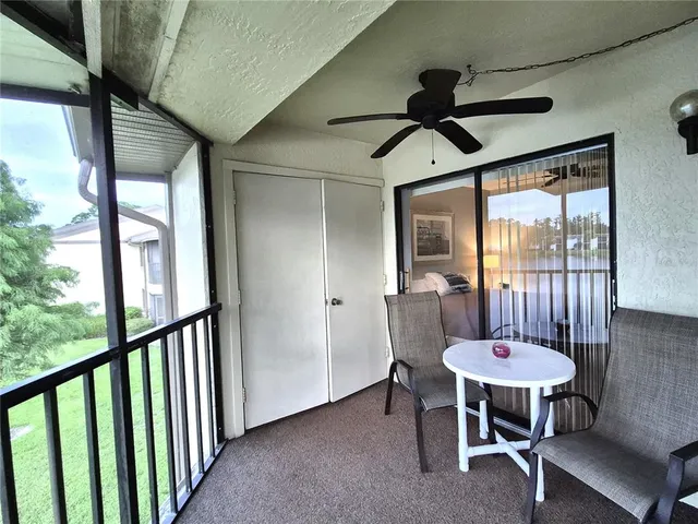 a view of a room with furniture window and wooden floor