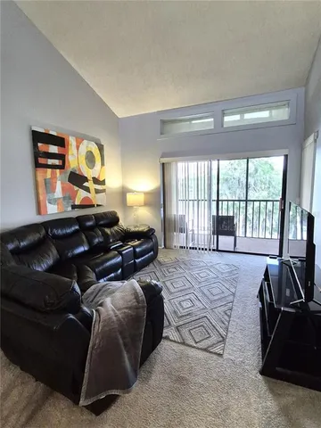 a bed room with a bed and a television