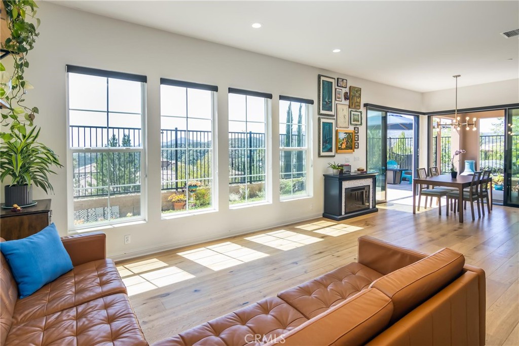 20724 Beech Circle Porter Ranch, CA 91326 - Photo 12 of 27 a living room with furniture and a floor to ceiling windows