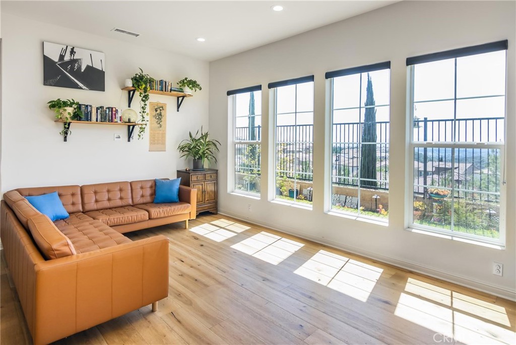 20724 Beech Circle Porter Ranch, CA 91326 - Photo 14 of 27 a living room with furniture and a large window