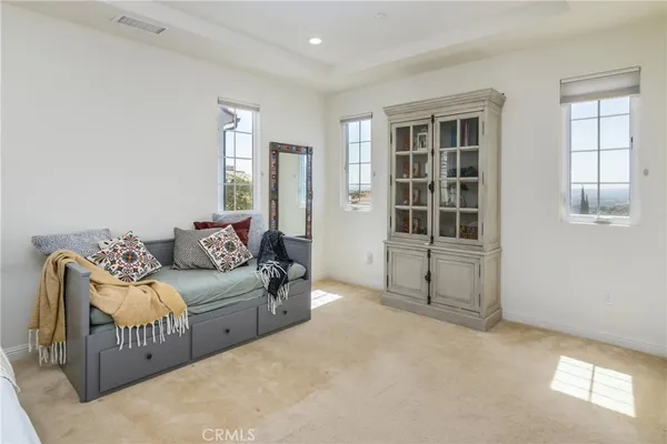 a living room with furniture and windows