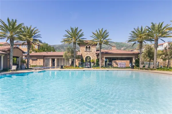 a view of a swimming pool and a chair