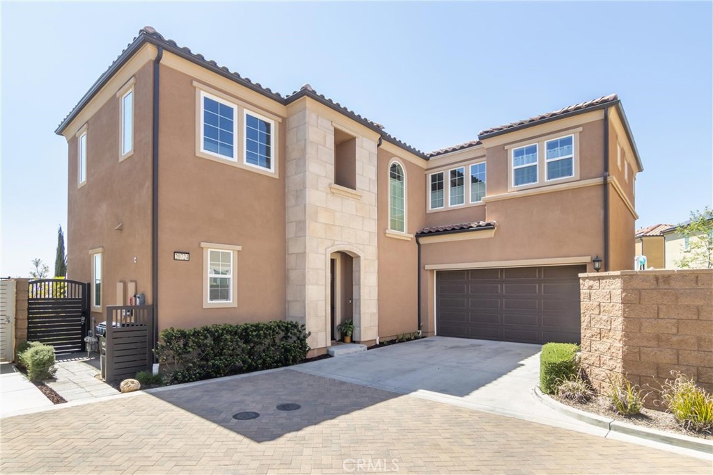 20724 Beech Circle Porter Ranch, CA 91326 - Photo 3 of 27 a front view of a house with yard