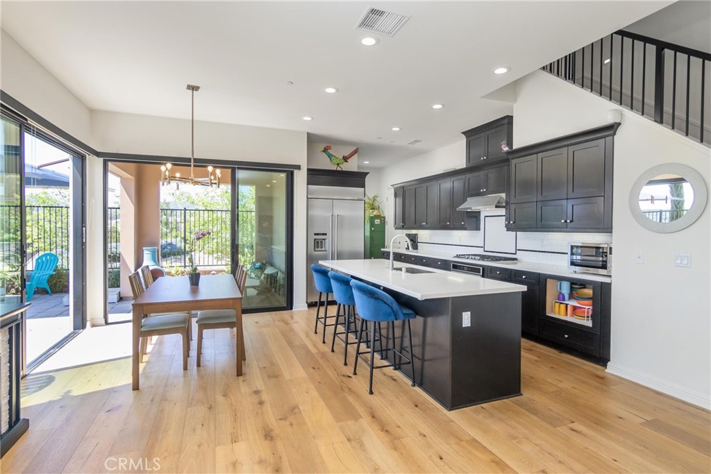 20724 Beech Circle Porter Ranch, CA 91326 - Photo 6 of 27 a kitchen with stainless steel appliances granite countertop a stove and a refrigerator