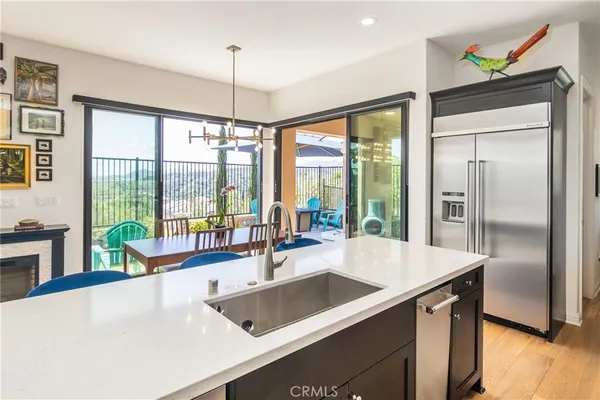 a kitchen with a sink and a large window