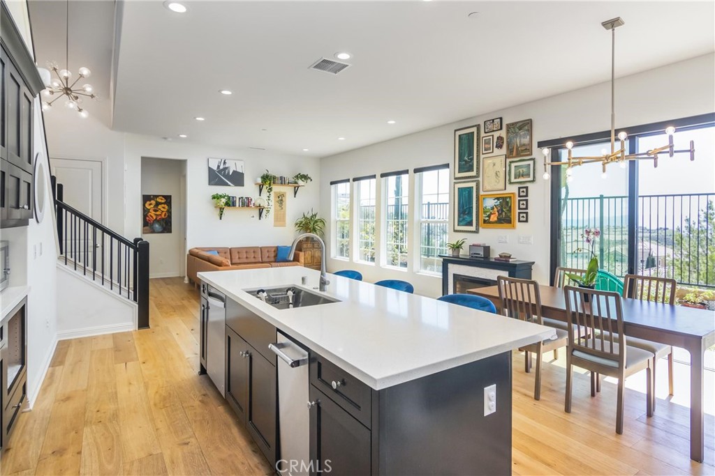 20724 Beech Circle Porter Ranch, CA 91326 - Photo 9 of 27 a kitchen that has a lot of cabinets in it