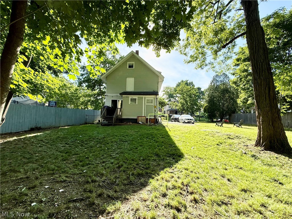 869 Berwin Street Akron, OH 44310 - Photo 3 of 16 Back exterior view of home featuring spacious fenced yard