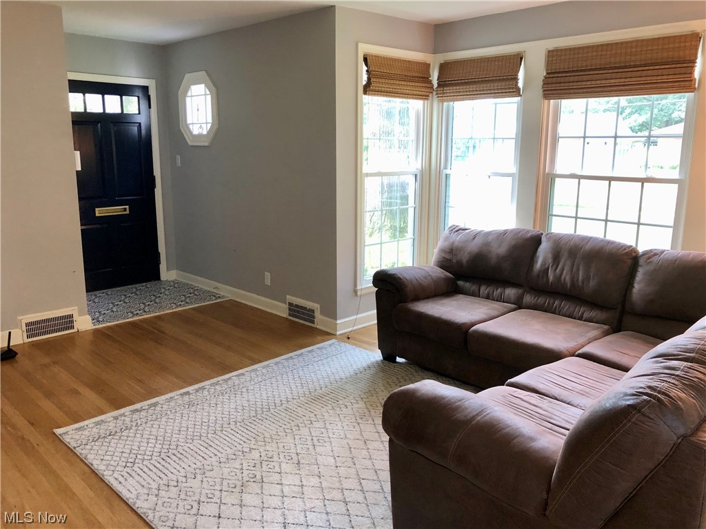 Living room with light hardwood flooring
