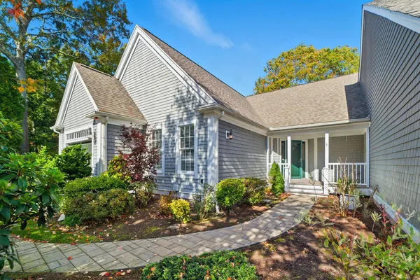 front view of a house with a yard